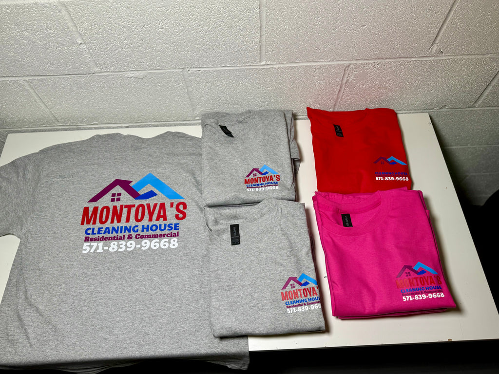 Four folded shirts with Montoya's Cleaning House logo on a tiled floor.