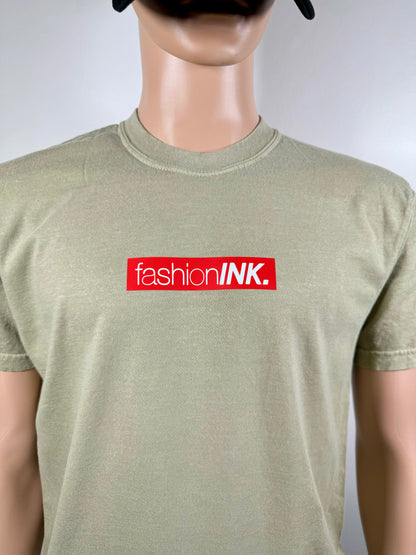 Mannequin wearing a green t-shirt with 'fashionINK.' logo on a white background