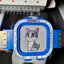 Embroidery machine with a cartoon cat design on a gray fabric