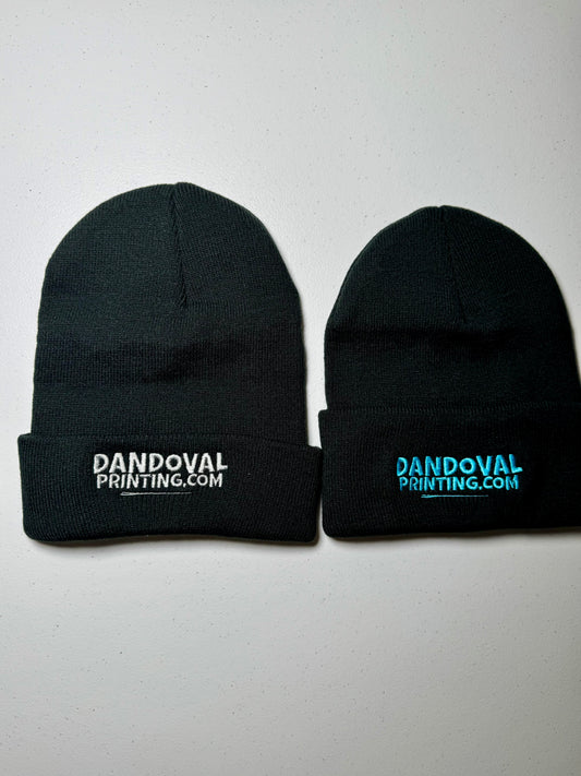 Two black beanie hats with 'Dandoval Printing.com' text on a white background