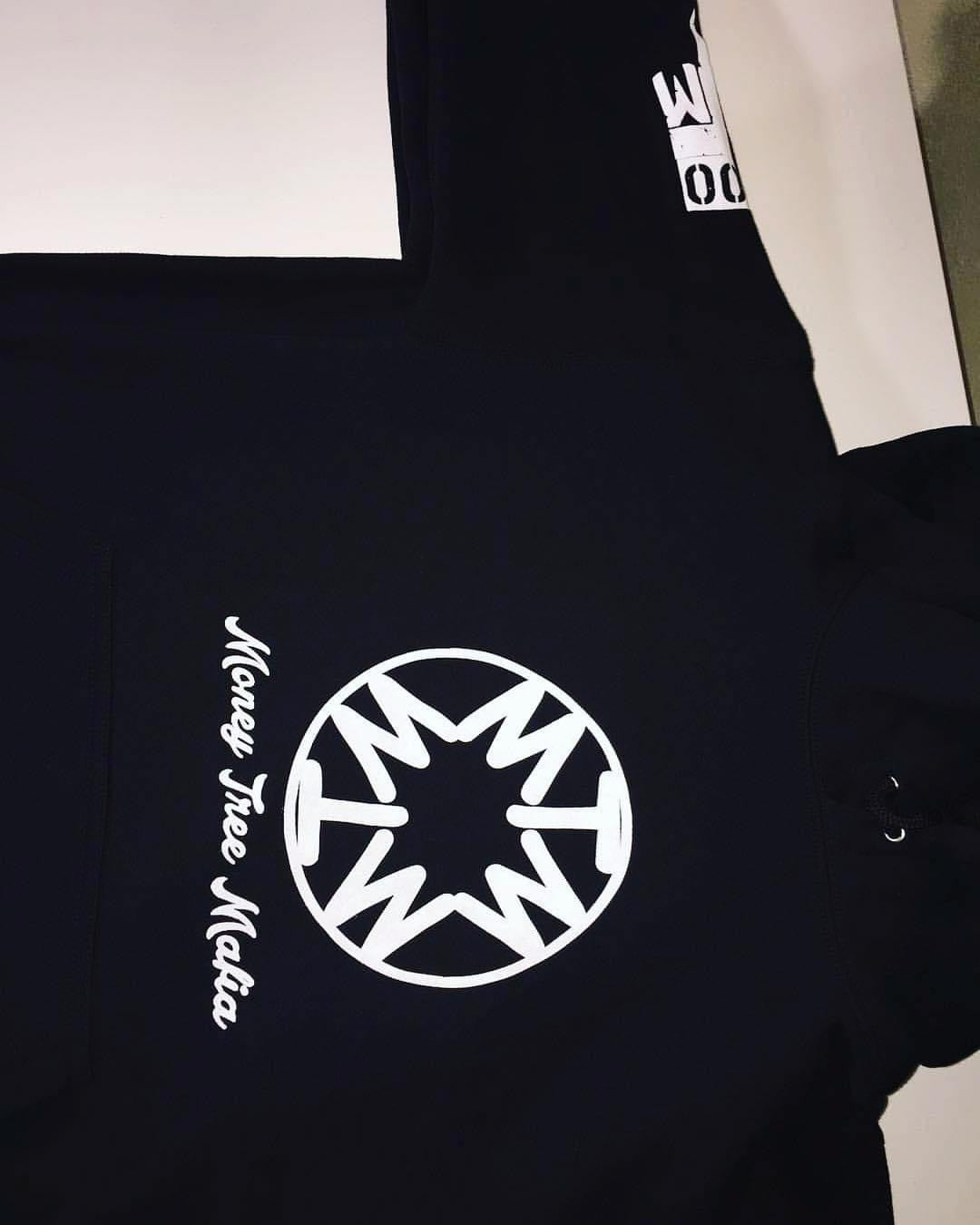 Black hoodie with white logo and text on a plain background