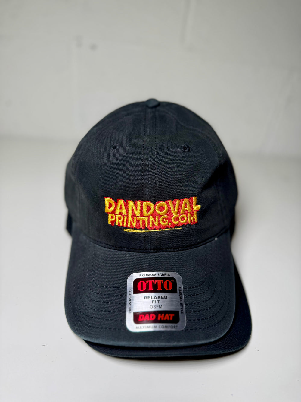 Black cap with 'Dandoval Printing.com' logo on a white background