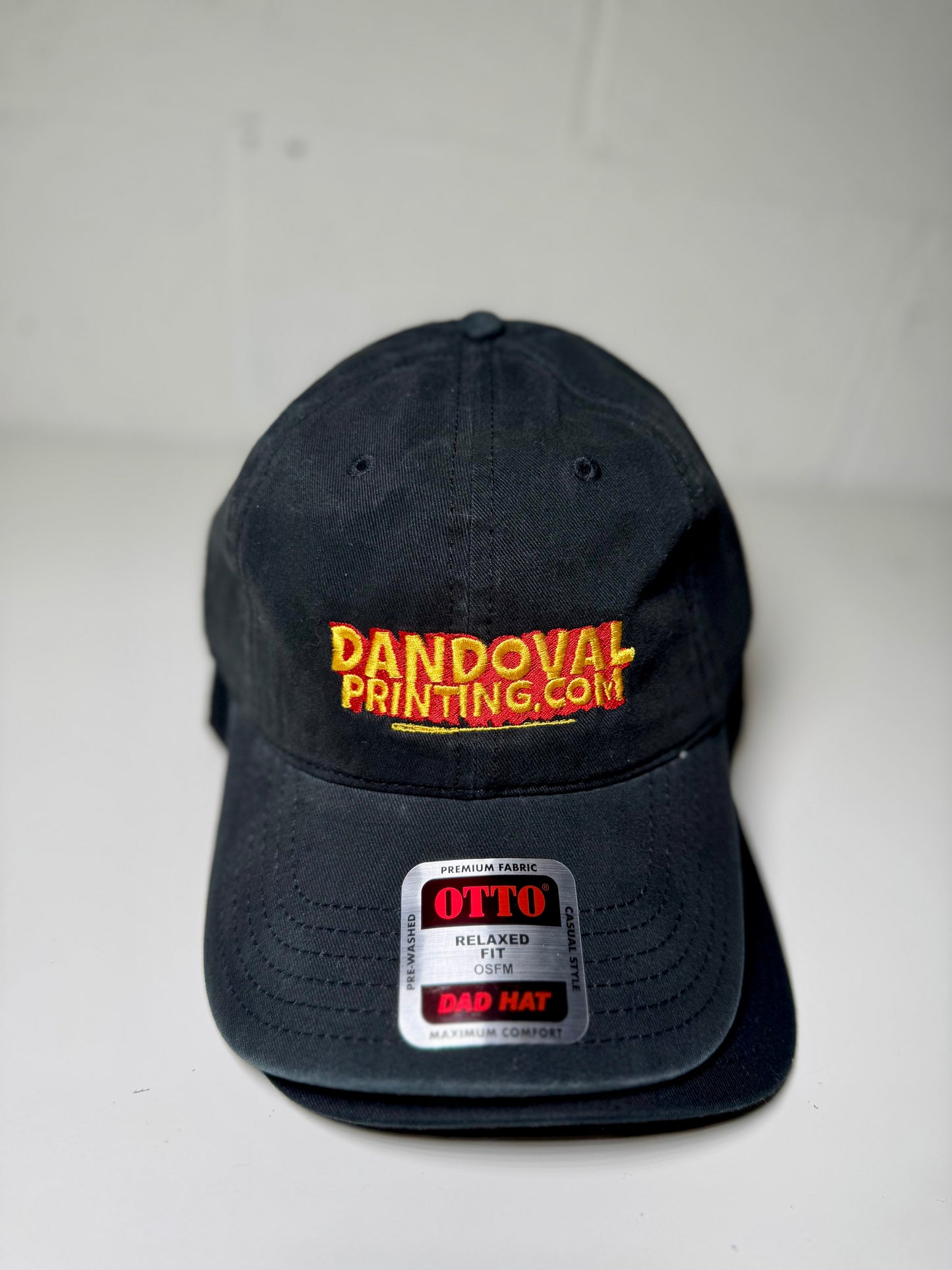 Black cap with 'Dandoval Printing.com' logo on a white background