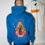 Blue hoodie with a colorful graphic design on a tiled floor.