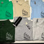 Collection of folded polo shirts with Yare Remodeling LLC logo on a light background