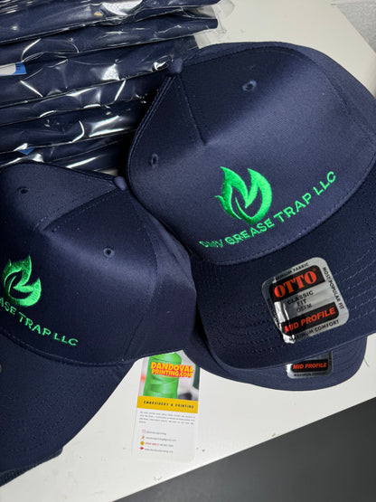 Navy blue caps with green logo and text on a gray surface