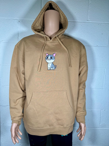 Beige hoodie with a cat graphic on a mannequin against a light gray brick wall.