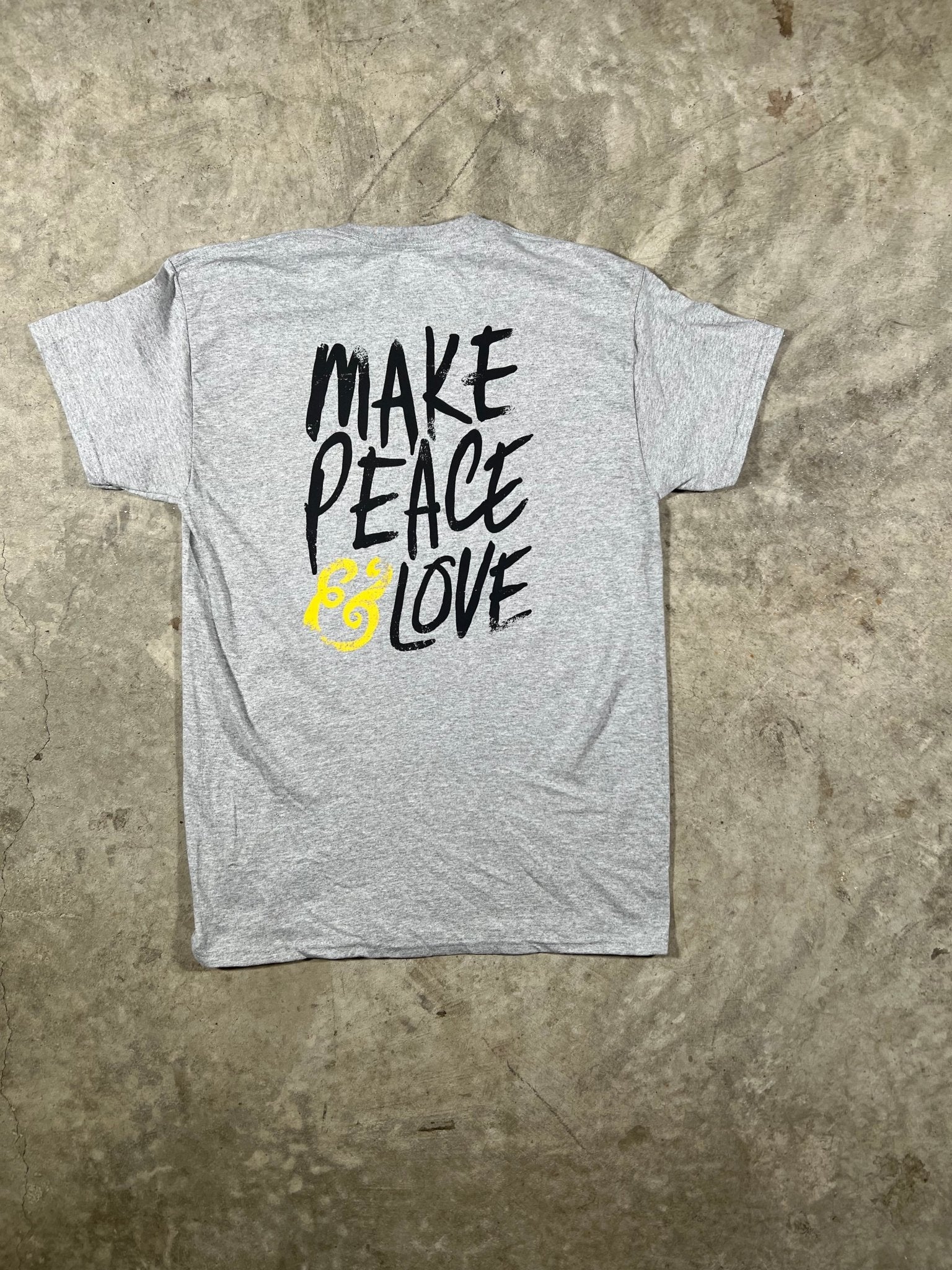 "Back view of MAKE PEACE & LOVE T-Shirt showcasing the distinctive back print, crafted from soft and durable cotton fabric."